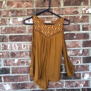 Open-shoulder, long sleeved blouse